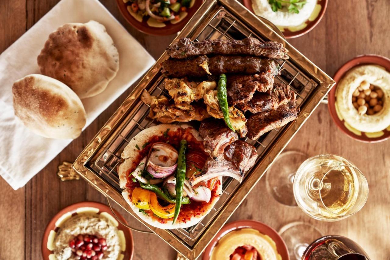 Fanar Hotel & Residences Salalah Exterior foto A selection of Middle Eastern cuisine